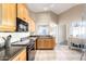 Bright kitchen with ample cabinet space, granite countertops, and stainless steel appliances at 7318 W Greer Ave, Peoria, AZ 85345