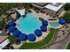 Aerial view of community pool, with multiple umbrellas at 7320 W Stony Quail Way, Florence, AZ 85132