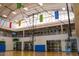 Spacious indoor court with basketball hoops and fitness equipment at 7320 W Stony Quail Way, Florence, AZ 85132