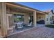 Outdoor patio with fireplace, seating area, and a built-in grill at 7320 W Stony Quail Way, Florence, AZ 85132