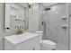Bathroom with modern vanity, gold fixtures, and a large shower at 7538 E Garfield St, Scottsdale, AZ 85257