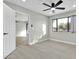 Bedroom with large window, light flooring, and access to other rooms at 7538 E Garfield St, Scottsdale, AZ 85257