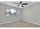 Spacious bedroom with ceiling fan and window coverings at 7538 E Garfield St, Scottsdale, AZ 85257
