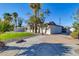 Side view of the house showcasing the driveway and landscaping at 7538 E Garfield St, Scottsdale, AZ 85257