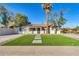 Newly renovated home with artificial turf lawn and modern facade at 7538 E Garfield St, Scottsdale, AZ 85257
