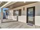 Modern front door with a covered porch and sleek design at 7538 E Garfield St, Scottsdale, AZ 85257