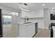 Open concept kitchen with island and view into dining area at 7538 E Garfield St, Scottsdale, AZ 85257