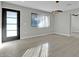 Light-filled living room with hardwood floors and large window at 7538 E Garfield St, Scottsdale, AZ 85257