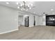 Open living area with hardwood floors and a modern fireplace at 7538 E Garfield St, Scottsdale, AZ 85257