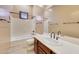 Clean bathroom with a bathtub, toilet, and a wood vanity at 10843 E La Junta Rd, Scottsdale, AZ 85255