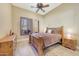 Cozy bedroom with a wooden bed frame and a view of the mountains at 10843 E La Junta Rd, Scottsdale, AZ 85255