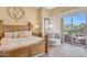Main bedroom with wood furniture and access to a patio at 10843 E La Junta Rd, Scottsdale, AZ 85255