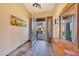 Bright entryway with wooden bench and access to backyard patio at 10843 E La Junta Rd, Scottsdale, AZ 85255