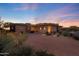Luxury home with stone accents and a landscaped front yard at 10843 E La Junta Rd, Scottsdale, AZ 85255