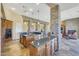 Kitchen with large island, granite countertops and stainless steel appliances at 10843 E La Junta Rd, Scottsdale, AZ 85255