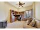 Home office with built-in wooden desk and a comfortable sofa at 10843 E La Junta Rd, Scottsdale, AZ 85255