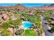 Community pool with lush landscaping and mountain views at 10843 E La Junta Rd, Scottsdale, AZ 85255