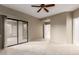 Bedroom with sliding door to patio and ceiling fan at 15050 N Thompson Peak Pkwy # 2006, Scottsdale, AZ 85260