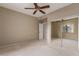 Bright bedroom with mirrored closet doors and ceiling fan at 15050 N Thompson Peak Pkwy # 2006, Scottsdale, AZ 85260
