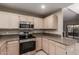 Kitchen with stainless steel appliances and light wood cabinets at 15050 N Thompson Peak Pkwy # 2006, Scottsdale, AZ 85260