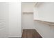 Spacious walk-in closet with ample shelving at 15977 W Gelding Dr, Surprise, AZ 85379