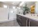 Double vanity bathroom with large walk-in shower at 21065 W Elm Way Ct, Buckeye, AZ 85396