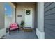Inviting front entry with modern door and charming decor at 21065 W Elm Way Ct, Buckeye, AZ 85396