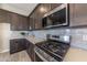 Modern kitchen with stainless steel appliances and ample counter space at 21065 W Elm Way Ct, Buckeye, AZ 85396