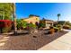 Tan colored home with stone accents and desert landscaping at 28831 N 128Th Dr, Peoria, AZ 85383