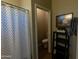 Small bathroom with toilet and a shelf unit at 333 E Redwood Ln, Phoenix, AZ 85048