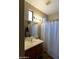 Bathroom features a vanity, shower and bathtub at 333 E Redwood Ln, Phoenix, AZ 85048