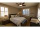 Bedroom with queen bed, ceiling fan, and window shutters at 333 E Redwood Ln, Phoenix, AZ 85048