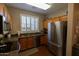 Kitchen boasts stainless steel appliances and wood cabinets at 333 E Redwood Ln, Phoenix, AZ 85048