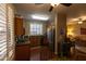 Kitchen with stainless steel appliances and wood cabinets at 333 E Redwood Ln, Phoenix, AZ 85048