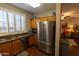 Modern kitchen features stainless steel appliances and granite countertops at 333 E Redwood Ln, Phoenix, AZ 85048
