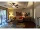Living area with hardwood floors, a comfortable sofa, and large artwork at 333 E Redwood Ln, Phoenix, AZ 85048