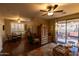 Living room with hardwood floors, patio access, and a cozy sitting area at 333 E Redwood Ln, Phoenix, AZ 85048