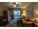 Living room with hardwood floors, patio access, and a cozy sitting area at 333 E Redwood Ln, Phoenix, AZ 85048