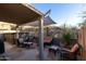 Relaxing patio with seating area, hot tub and shade sail at 333 E Redwood Ln, Phoenix, AZ 85048