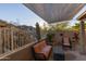 Cozy patio with seating area and shade sail at 333 E Redwood Ln, Phoenix, AZ 85048
