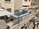 Relaxing swimming pool with a shade cover and safety fence at 333 E Redwood Ln, Phoenix, AZ 85048