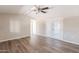 Bright living room with wood-look floors and ceiling fan at 9302 E Broadway Rd # 073, Mesa, AZ 85208