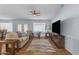 Bright and airy living room with hardwood floors and ample natural light at 10902 E Keats Ave, Mesa, AZ 85209