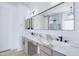 Bathroom boasts double sinks, marble countertops, and a large mirror at 1270 E Baranca Rd, Gilbert, AZ 85297