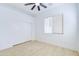 Light and airy bedroom with wood-look floors and a double door closet at 1270 E Baranca Rd, Gilbert, AZ 85297