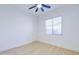 Bright bedroom with wood-look tile floors and ceiling fan at 1270 E Baranca Rd, Gilbert, AZ 85297