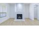 Modern whitewashed stone fireplace with marble hearth at 1270 E Baranca Rd, Gilbert, AZ 85297