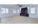 Bright living room with a modern fireplace and built-in shelving at 1270 E Baranca Rd, Gilbert, AZ 85297