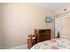 Bedroom featuring a dresser and wall-mounted TV at 14950 W Mountain View Blvd # 4308, Surprise, AZ 85374