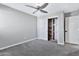 Bedroom with carpet, ceiling fan, and built-in shelving at 16616 E Palisades Blvd # 102, Fountain Hills, AZ 85268